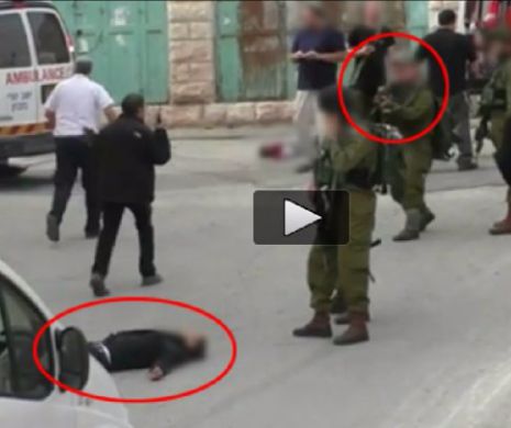 Un soldat israelian A ÎMPUŞCAT ÎN CAP un TERORIST întins pe asfalt şi DEJA LICHIDAT. Imagini şocante│Video