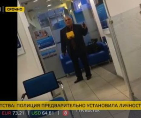 TEROARE LA MOSCOVA: Un SMINTIT amenință că se detonează într-o bancă. 4 oameni au fost luați OSTATICI | FOTO