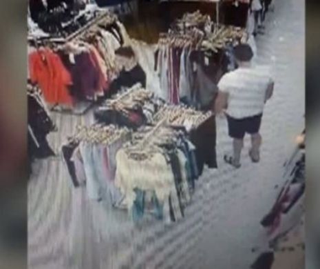 Metoda ingenioasă prin care doi hoţi furau rochii din magazine. Poliţia e pe urmele lor