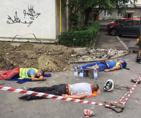 Trei muncitori, surprinși în timp ce se odihneau pe stradă