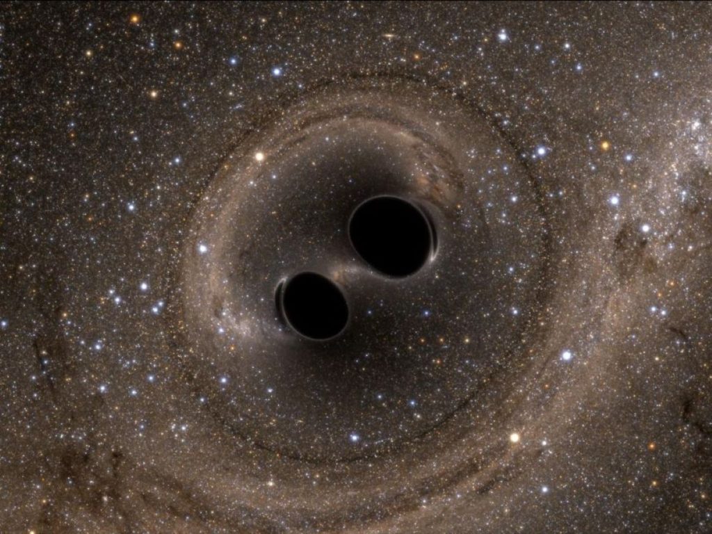 Când o gaură neagră înghite o altă gaură neagră, Universul are „frisoane”