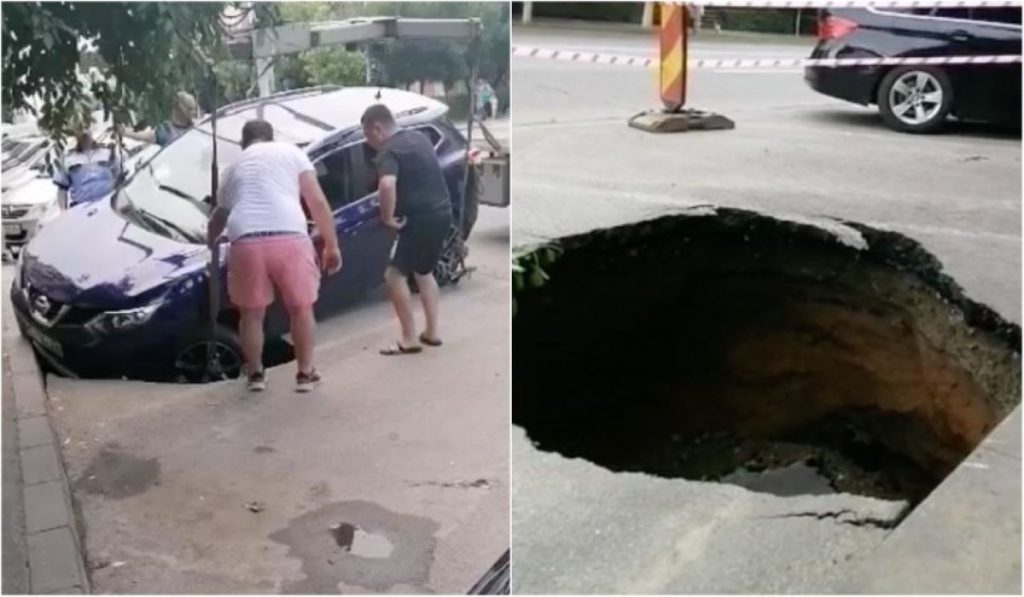 Craiova. O mașină a căzut într-o groapă imensă. S-a surpat asfaltul sub ea Video
